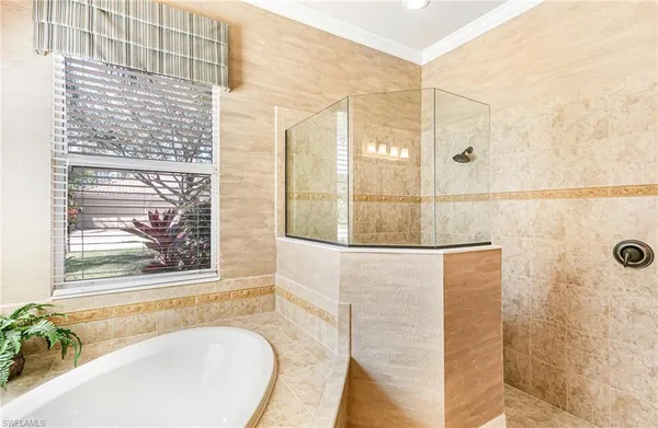 a bathroom with a bathtub and a shower