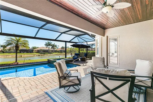 a view of a patio with a table chairs and a table