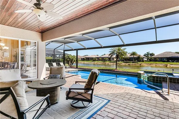 a view of a patio with swimming pool