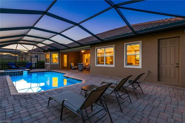 a view of a swimming pool with a lounge chairs