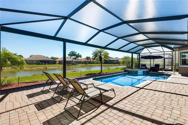 a view of a swimming pool with a patio