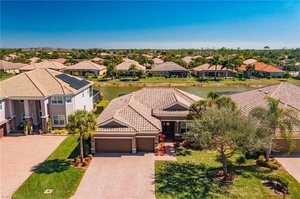 a view of a swimming pool and lounge chair