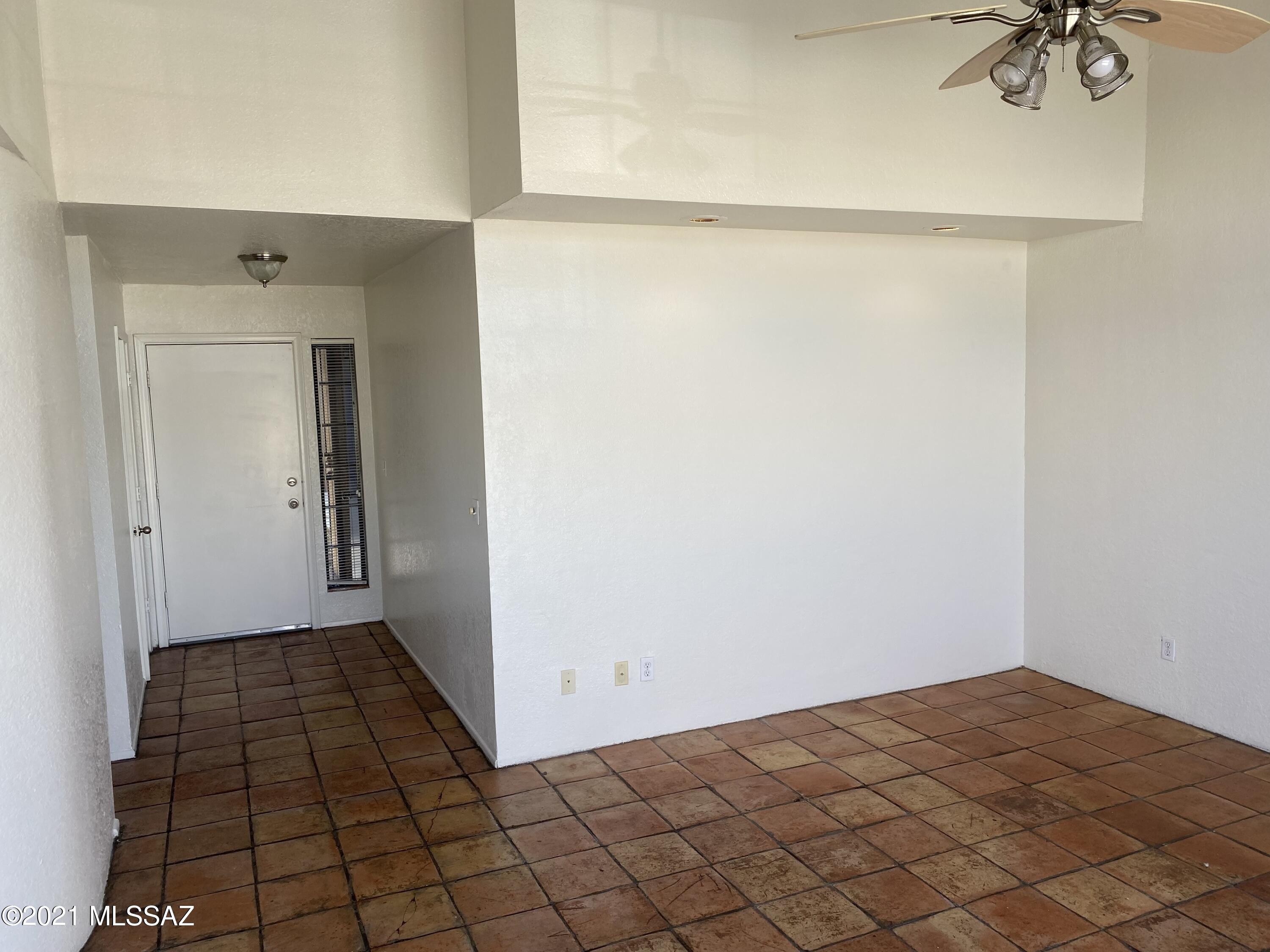 210 East Pastime Road Tucson, AZ 85705 - Photo 11 of 29 a view of a closet area with wooden floor