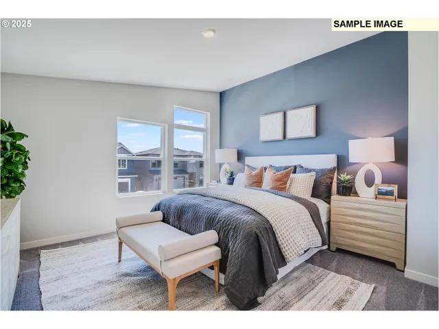 a bedroom with a bed a mirror and a window