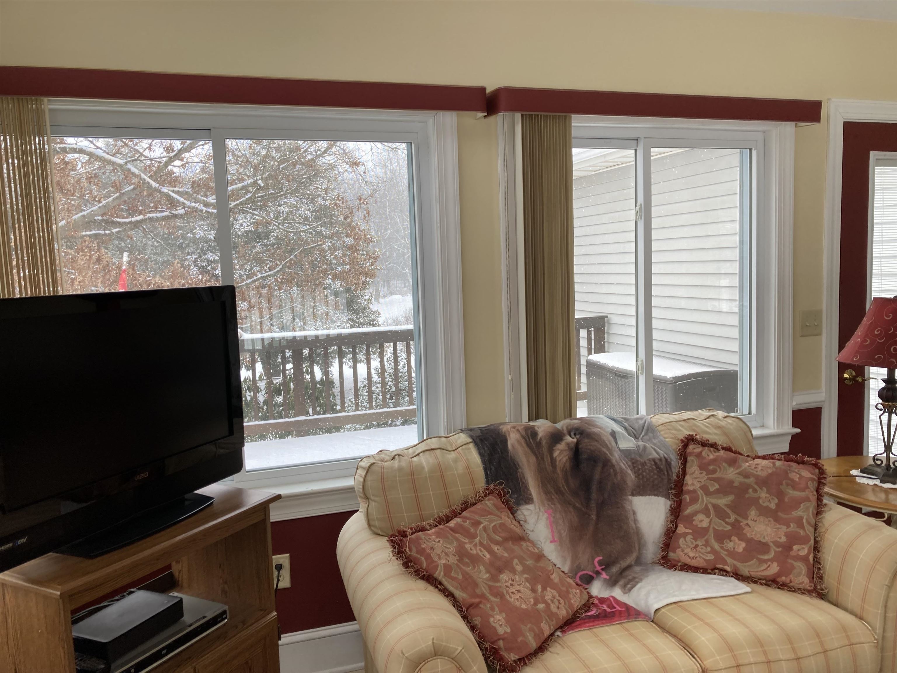 36 Spring Court Waynesboro, VA 22980 - Photo 42 of 72 a living room with furniture a flat screen tv and a floor to ceiling window