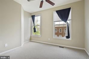 337 Main Street Gaithersburg, MD 20878 - Photo 17 of 35 an empty room with windows and closet