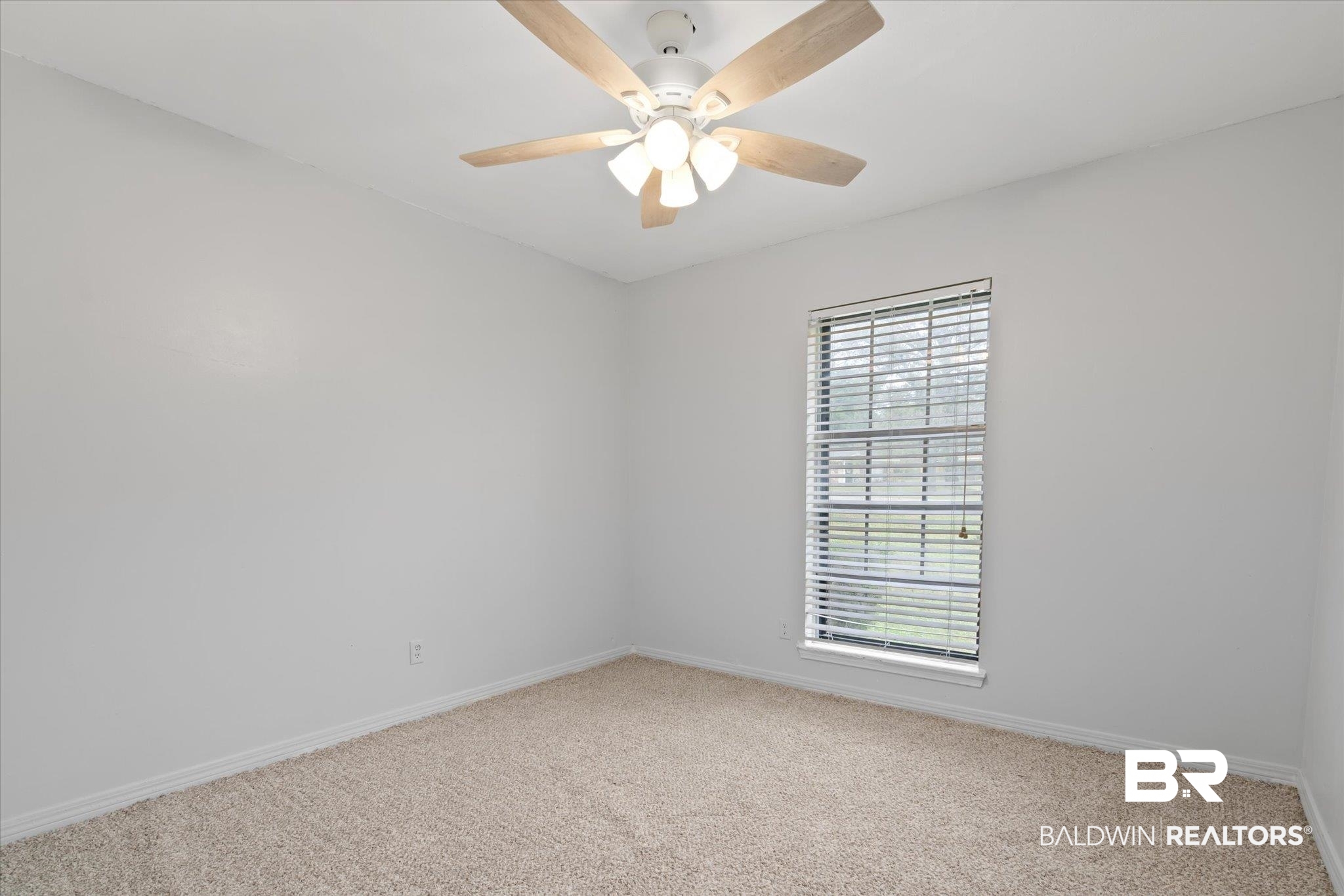9445 Howells Ferry Road Semmes, AL 36575 - Photo 17 of 20 Spare room featuring plenty of natural light and carpet floors