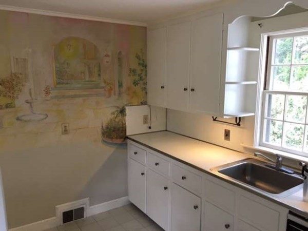 103 Mayo Road Wellesley, MA 02482 - Photo 8 of 20 a kitchen with a sink and cabinets