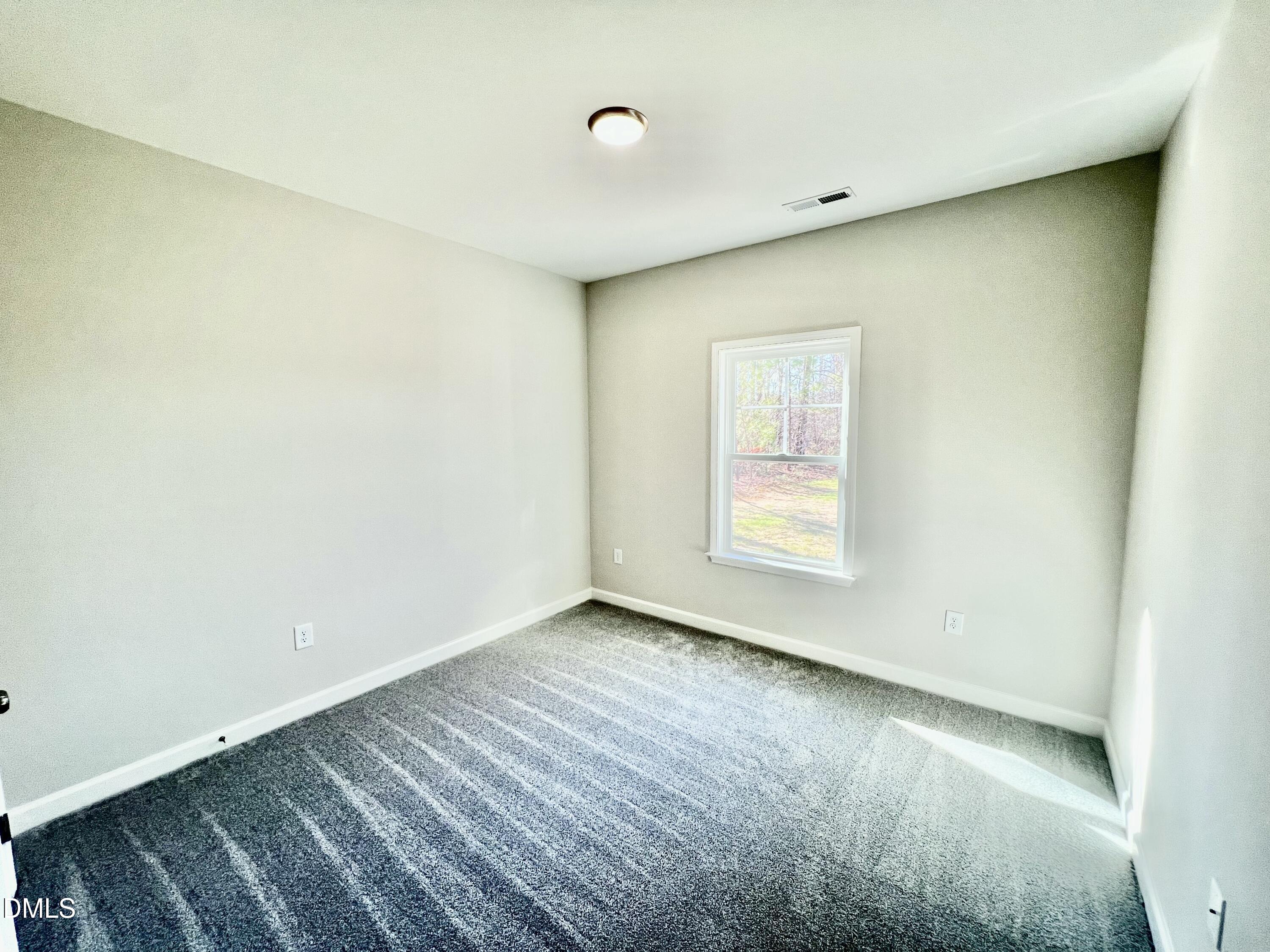 711 Polly Watson Road Fremont, NC 27830 - Photo 14 of 21 a view of an empty room with a window