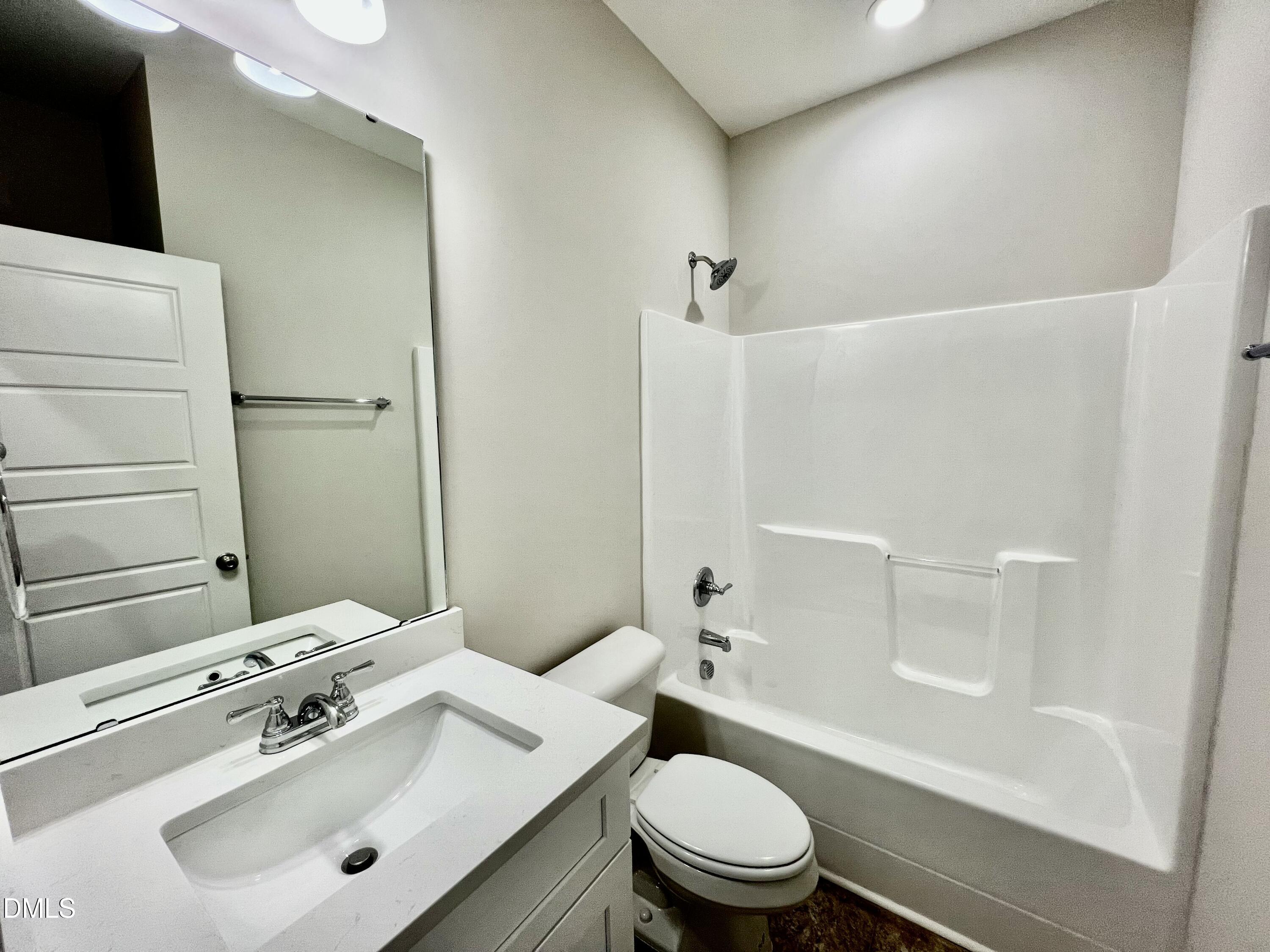 711 Polly Watson Road Fremont, NC 27830 - Photo 16 of 21 a bathroom with a sink mirror toilet and shower