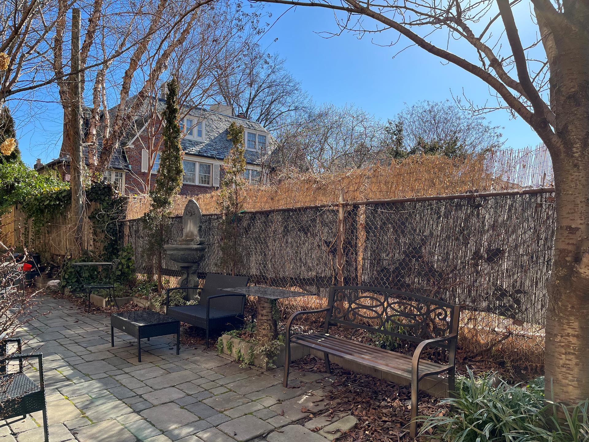 86-10 34th Avenue, Unit 113 Queens, NY 11372 - Photo 12 of 13 a backyard of a house with outdoor seating