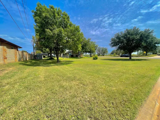 a view of a house with a big yard