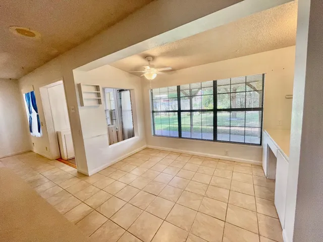 a kitchen with a sink a stove and cabinets