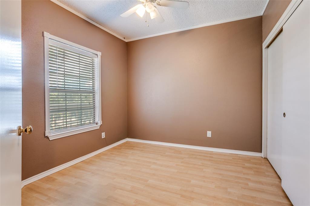 5310 Keller Springs Road, Unit 138 Dallas, TX 75248 - Photo 6 of 12 a view of an empty room with a window