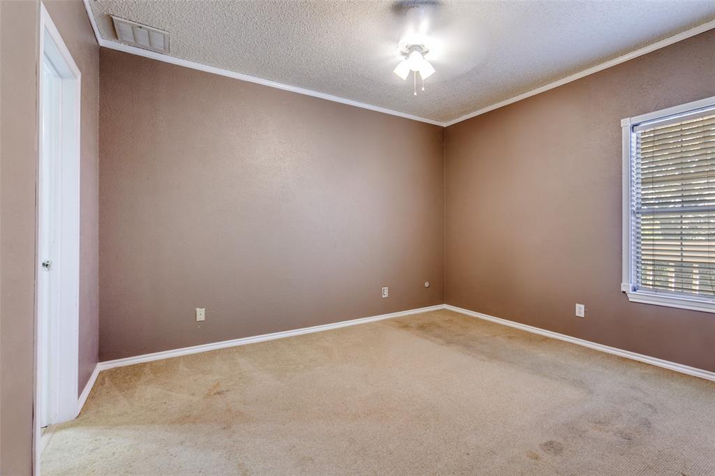 5310 Keller Springs Road, Unit 138 Dallas, TX 75248 - Photo 7 of 12 an empty room with a window