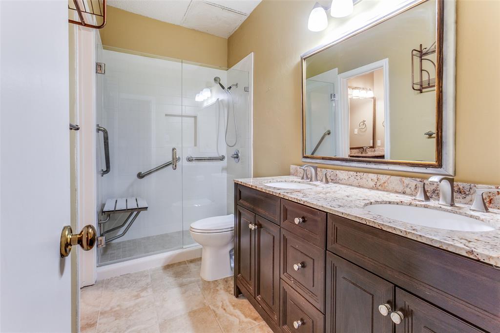 5310 Keller Springs Road, Unit 138 Dallas, TX 75248 - Photo 9 of 12 a spacious bathroom with a granite countertop sink toilet and shower