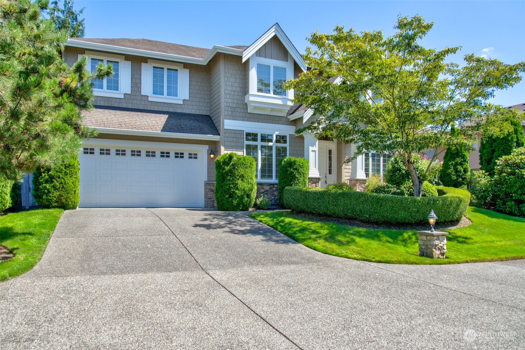 4001 221st Place Southeast Bothell, WA 98021 - Photo 1 of 1 a front view of a house with a yard and garage
