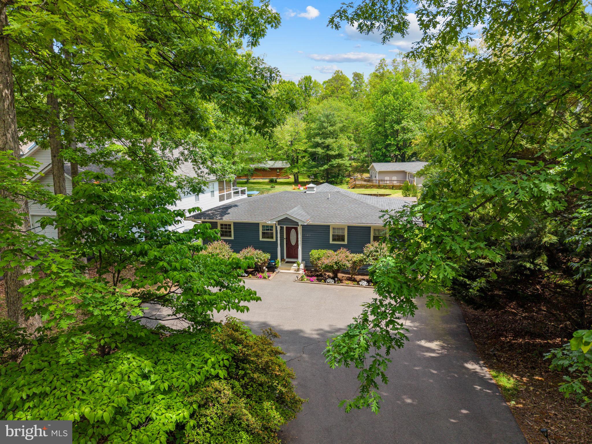 102 Confederate Circle Locust Grove, VA 22508 - Photo 44 of 45 Charming home nestled in lush greenery.
