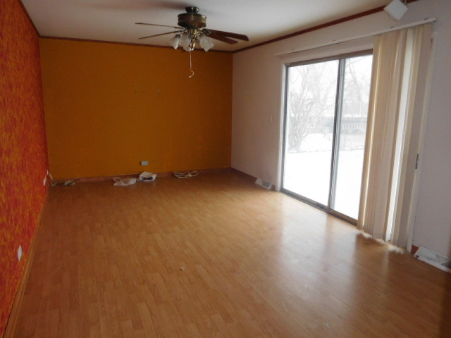 450 Rothbury Drive Bolingbrook, IL 60440 - Photo 7 of 15 wooden floor in an empty room with a window