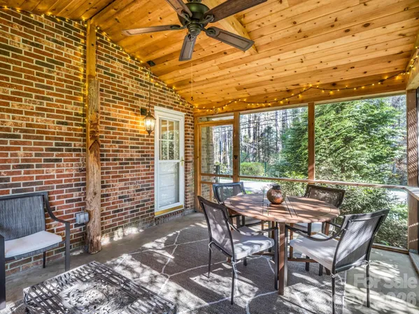 a view of a patio with a table and chairs