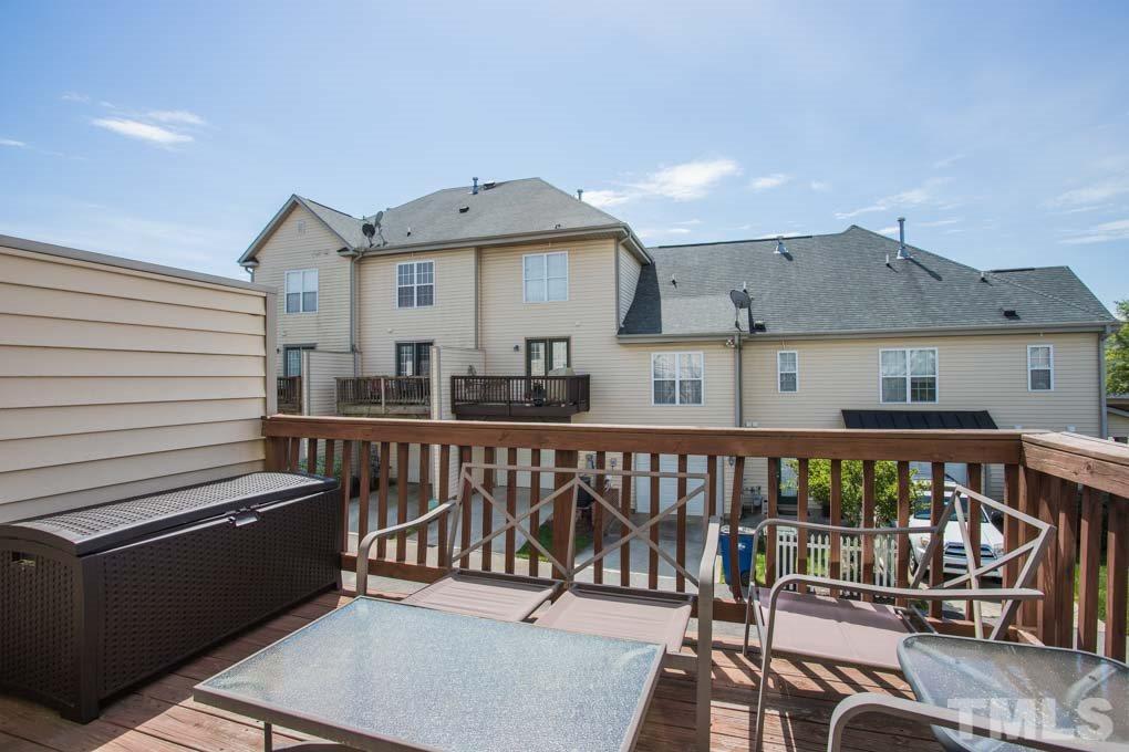 9712 Jordy Drive, Unit 291 Raleigh, NC 27617 - Photo 15 of 15 a view of a balcony with wooden floor and outdoor seating