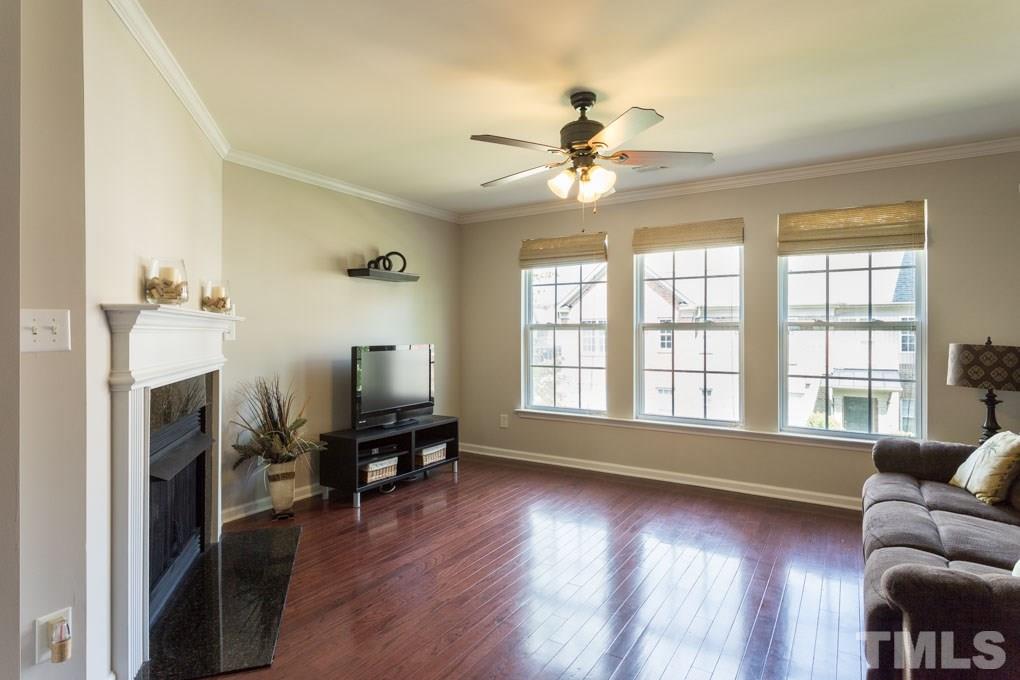 9712 Jordy Drive, Unit 291 Raleigh, NC 27617 - Photo 4 of 15 a living room with furniture and a fireplace