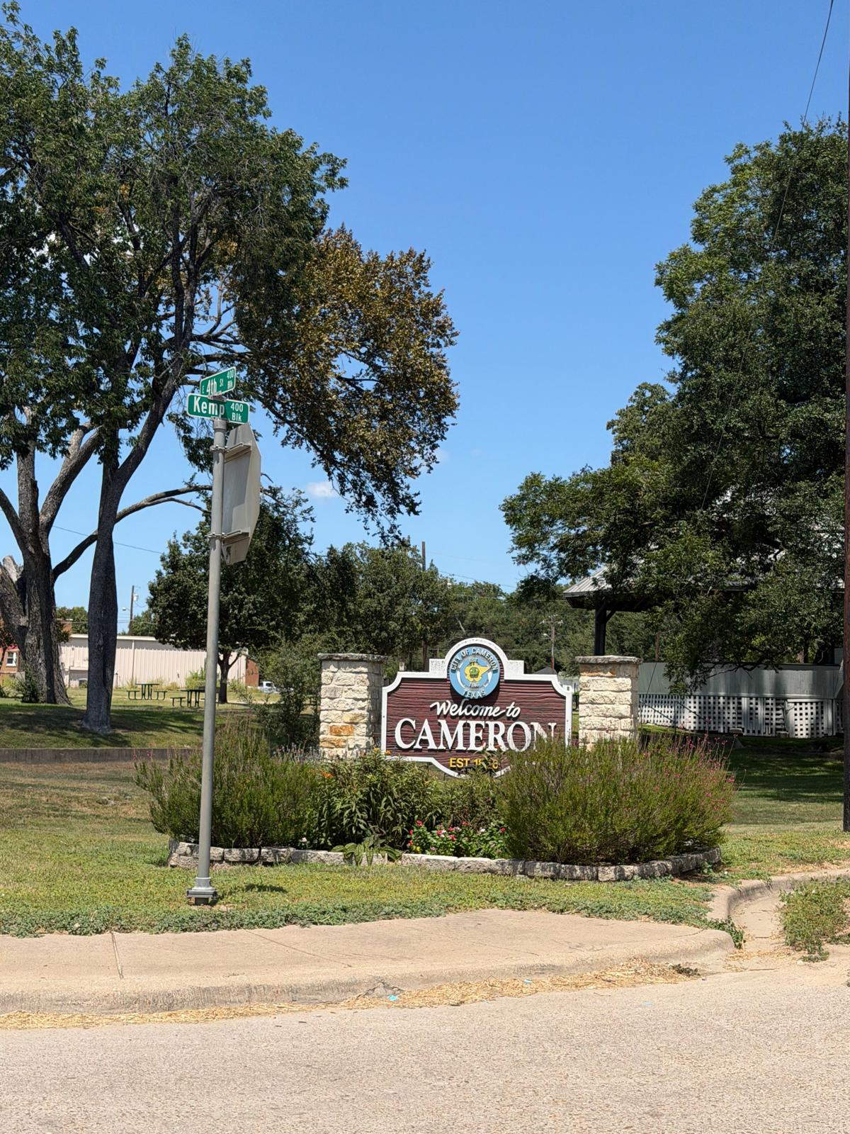 0 County Road 238 Road Cameron, TX 76520 - Photo 17 of 21 A warm welcome to Cameron, marked by a charming sign nestled amidst lush landscaping.