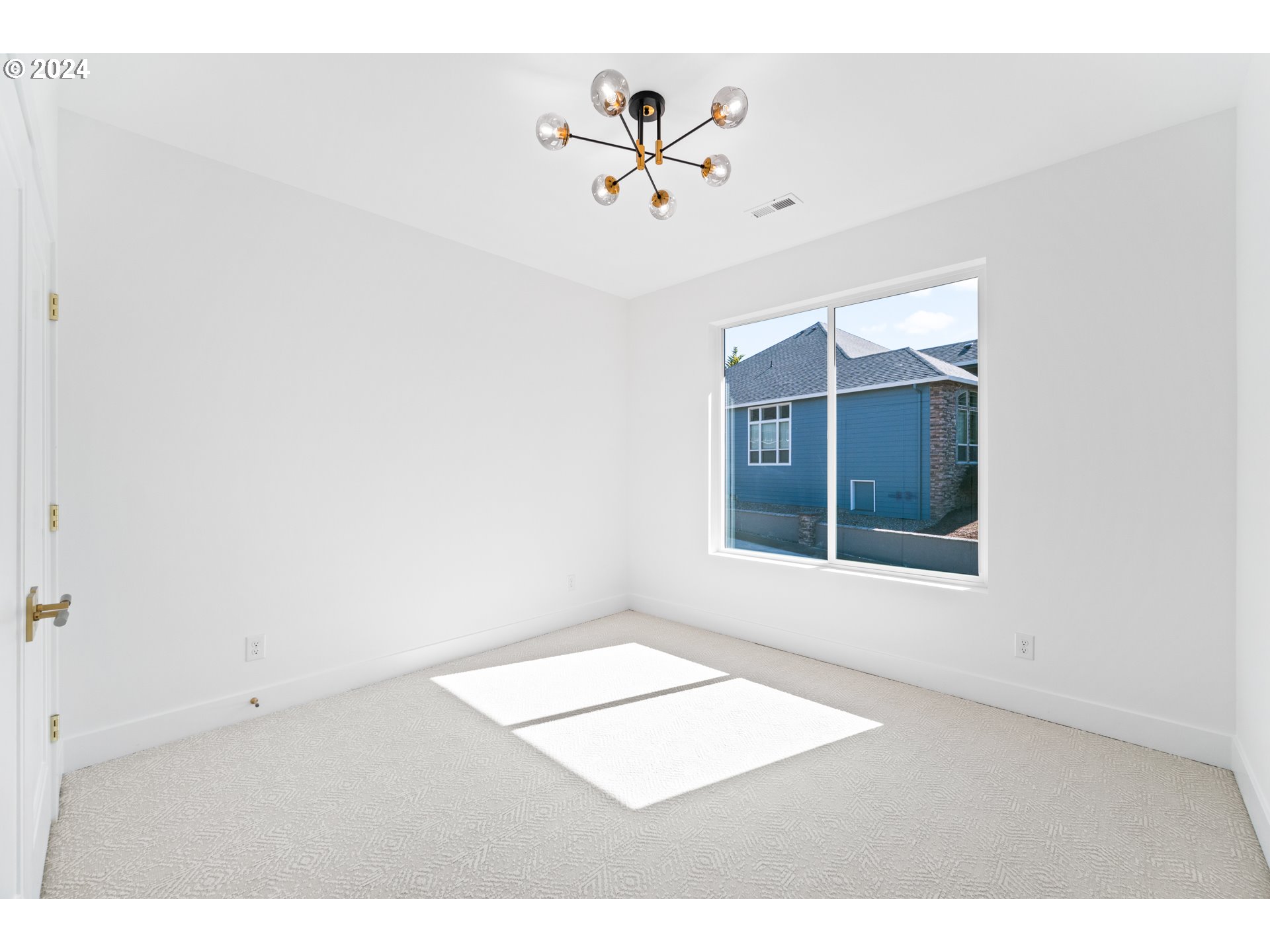 2007 South 16th Drive Ridgefield, WA 98642 - Photo 36 of 48 an empty room with a window and a ceiling fan