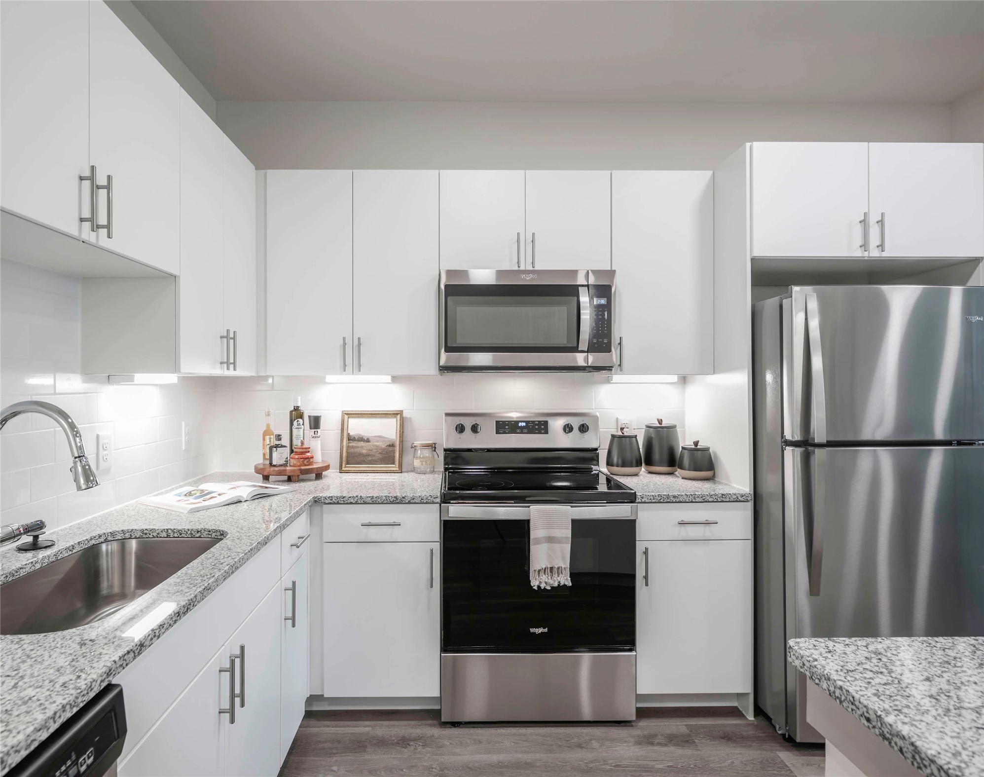 13958 Cottingham Road, Unit 3104 Houston, TX 77048 - Photo 4 of 22 a kitchen with a sink white stove and refrigerator