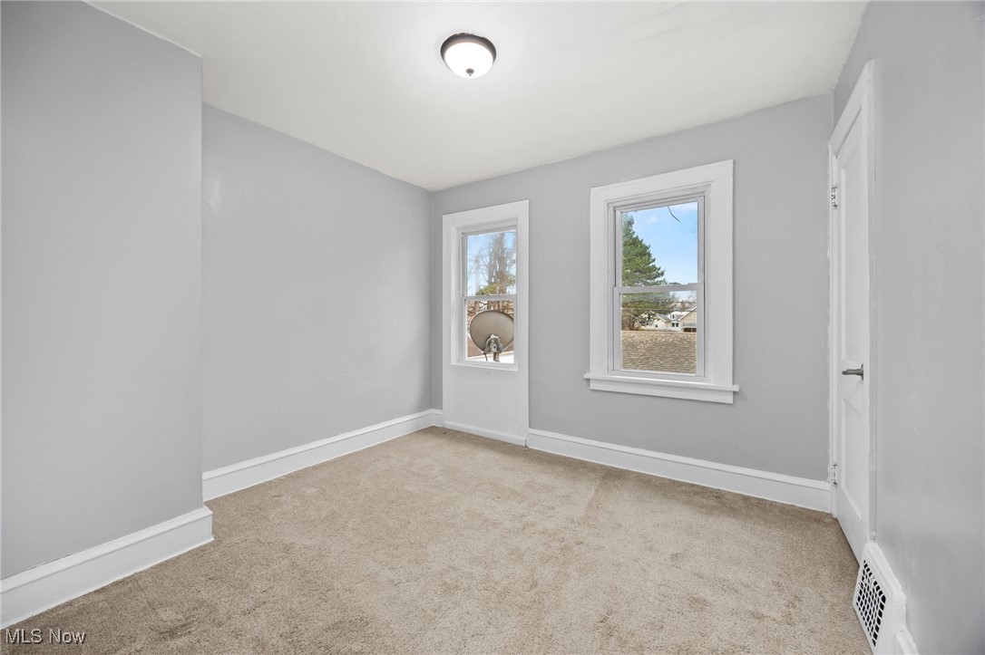 3368 Berea Road Cleveland, OH 44111 - Photo 16 of 26 Spare room with baseboards and light carpet
