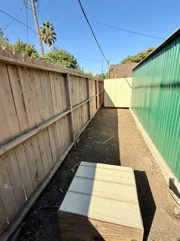 a view of a backyard of the house