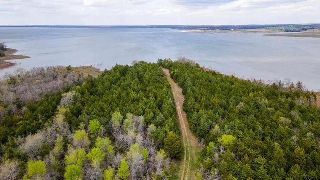 a view of a lake with a yard