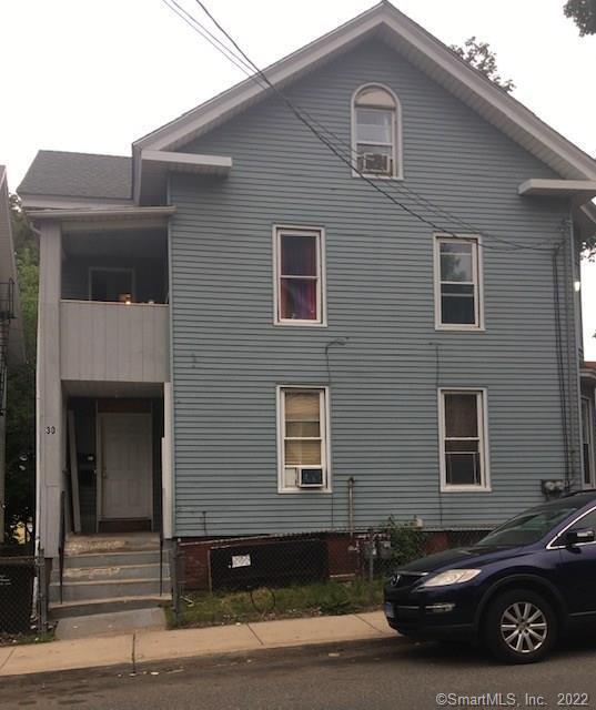 30 Olive Street Meriden, CT 06450 - Photo 1 of 1 a car parked in front of a house
