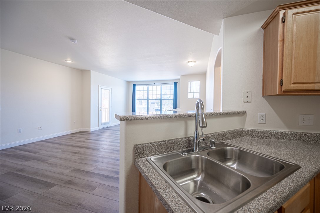 8555 West Russell Road, Unit 2062 Las Vegas, NV 89113 - Photo 35 of 35 A pristine interior boasts new flooring and a luminous open floorplan, perfect for modern living.