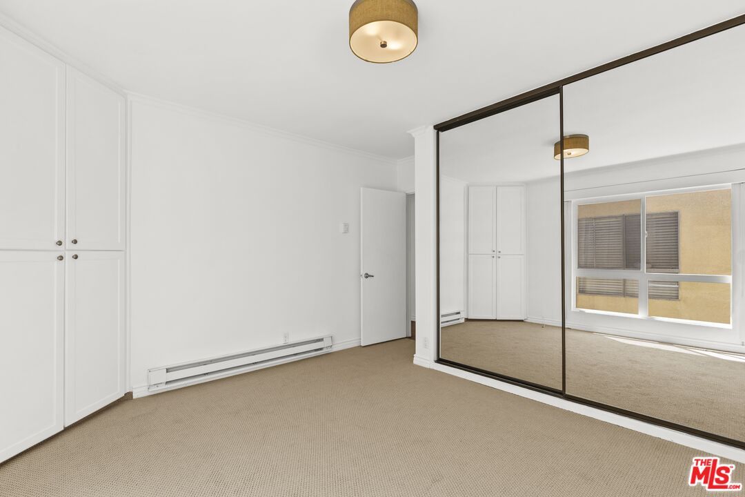 25 Spinnaker Street, Unit 12 Marina del Rey, CA 90292 - Photo 13 of 29 a view of an empty room and window