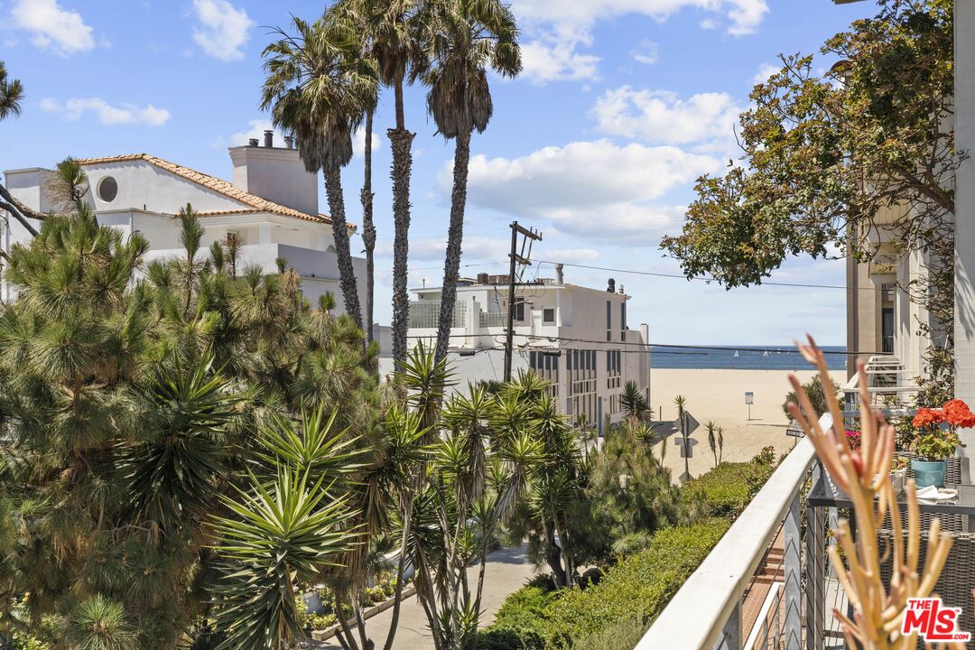 25 Spinnaker Street, Unit 12 Marina del Rey, CA 90292 - Photo 4 of 29 a view of a residential apartment building with a yard and potted plants