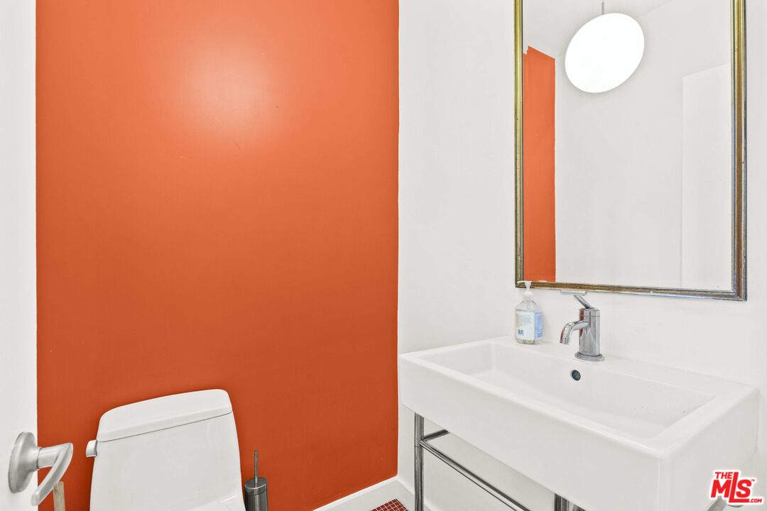 25 Spinnaker Street, Unit 12 Marina del Rey, CA 90292 - Photo 8 of 29 a bathroom with a sink a toilet and mirror