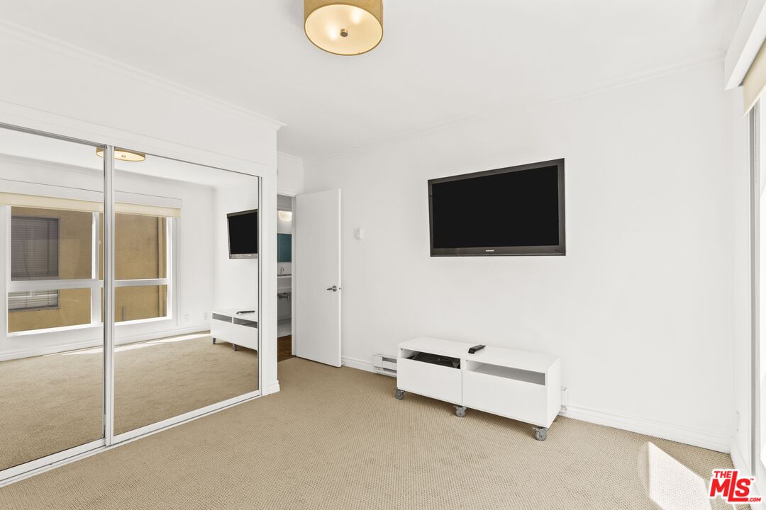 25 Spinnaker Street, Unit 12 Marina del Rey, CA 90292 - Photo 10 of 29 a living room with furniture and a flat screen tv