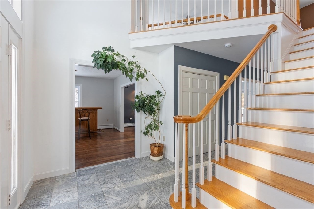 204 Old Farm Road Leominster, MA 01453 - Photo 20 of 40 a view of an entryway with wooden floor and a potted plant