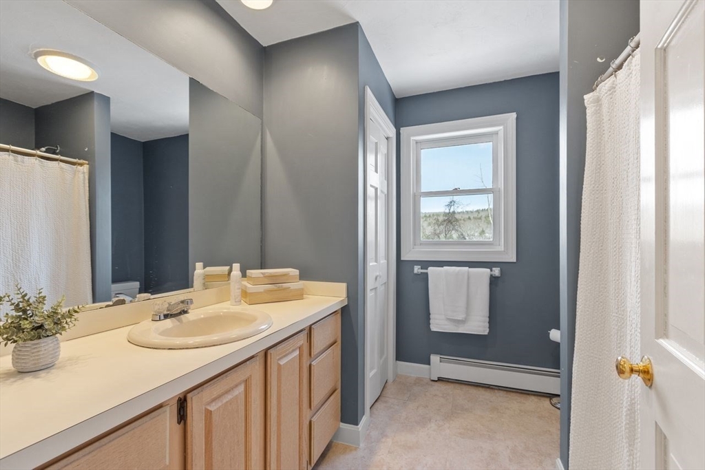 204 Old Farm Road Leominster, MA 01453 - Photo 32 of 40 a bathroom with a sink and a mirror