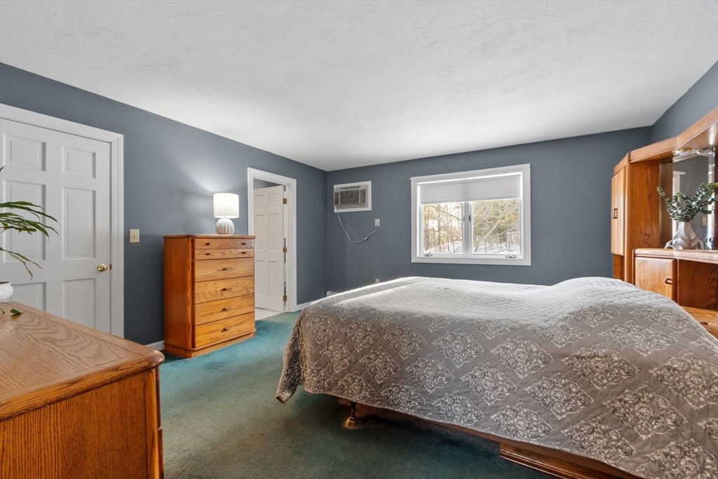 204 Old Farm Road Leominster, MA 01453 - Photo 34 of 40 a bedroom with a bed and a dresser