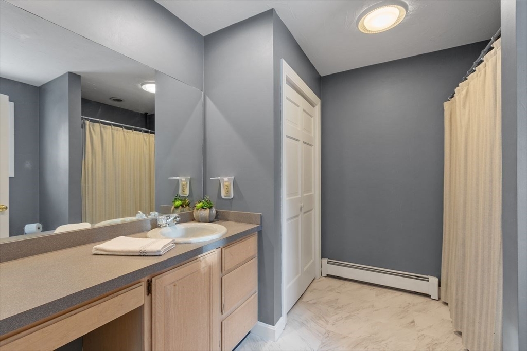 204 Old Farm Road Leominster, MA 01453 - Photo 36 of 40 a bathroom with a sink and a mirror