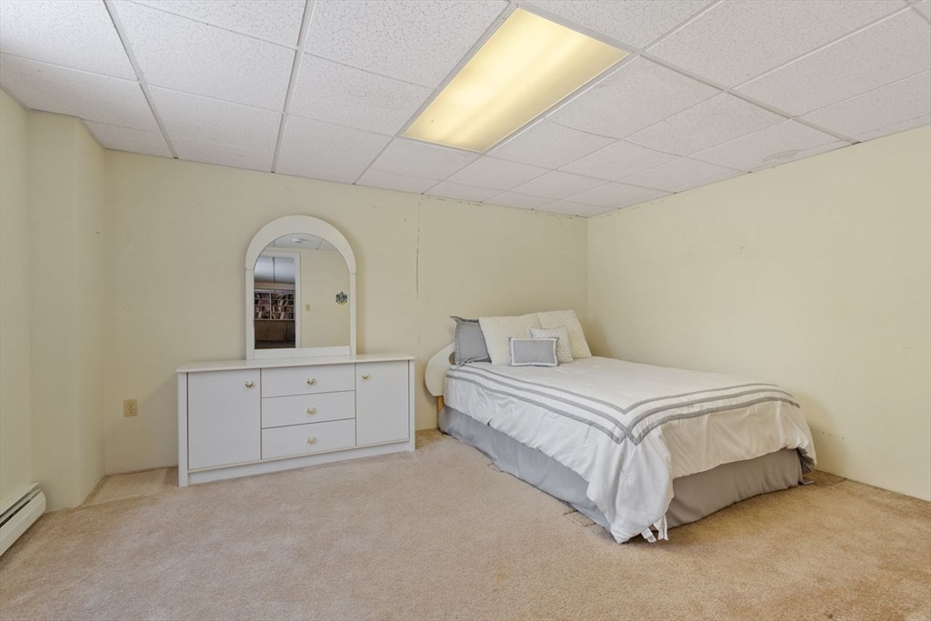 204 Old Farm Road Leominster, MA 01453 - Photo 38 of 40 a spacious bedroom with a bed and window