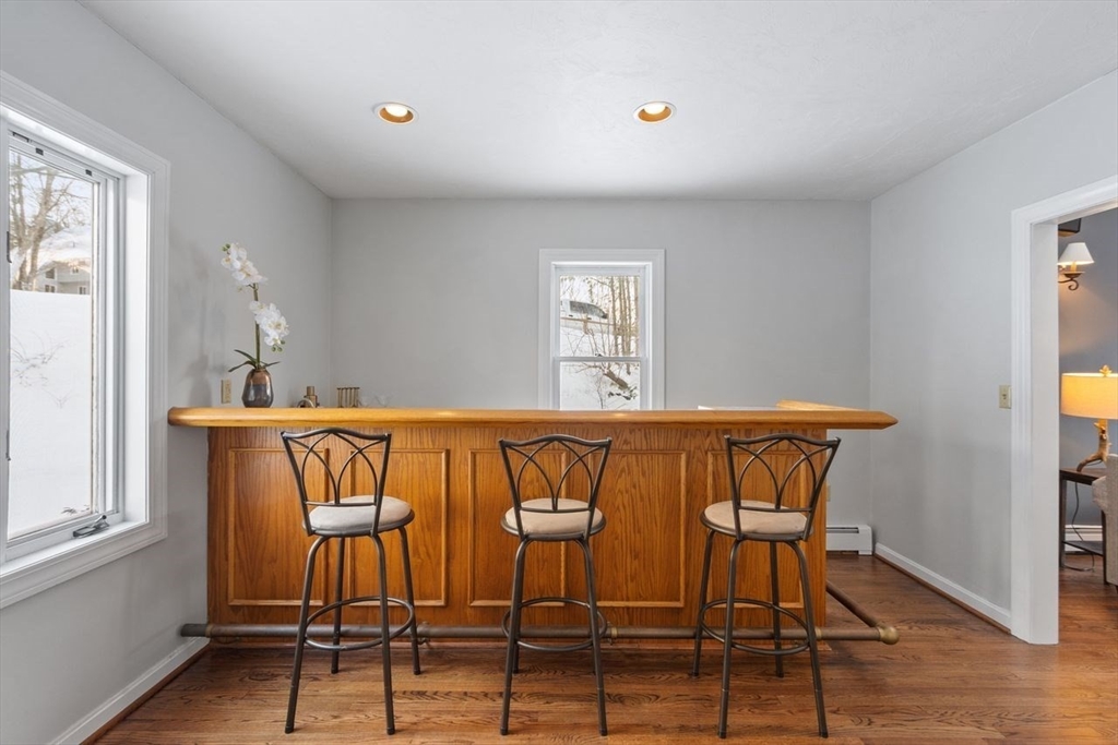 204 Old Farm Road Leominster, MA 01453 - Photo 10 of 40 a view of dining room and kitchen with furniture window and wooden floor