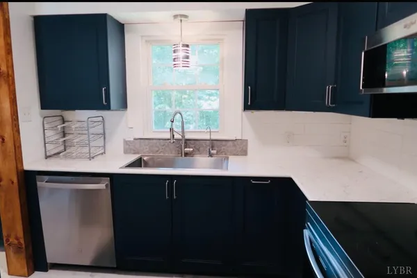 a bathroom with a sink vanity and a mirror