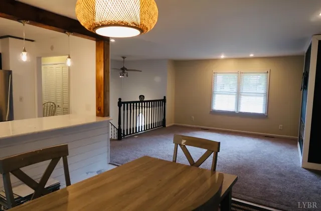 a view of a livingroom with furniture and chandelier