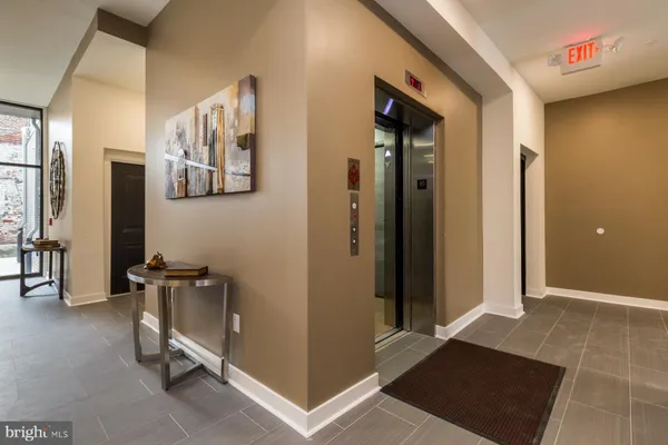 a view of a hallway with workspace