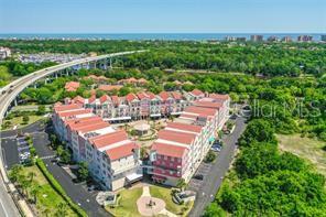 101 Palm Harbor Parkway, Unit A403 Palm Coast, FL 32137 - Photo 2 of 5 an aerial view of house with yard swimming pool and outdoor seating