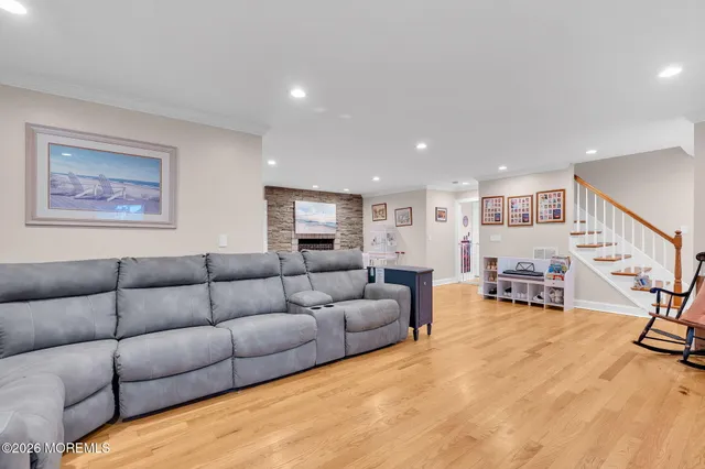 a view of a livingroom with a fireplace and window
