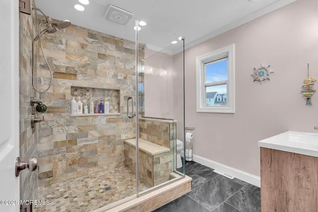 a bathroom with a sink and mirror